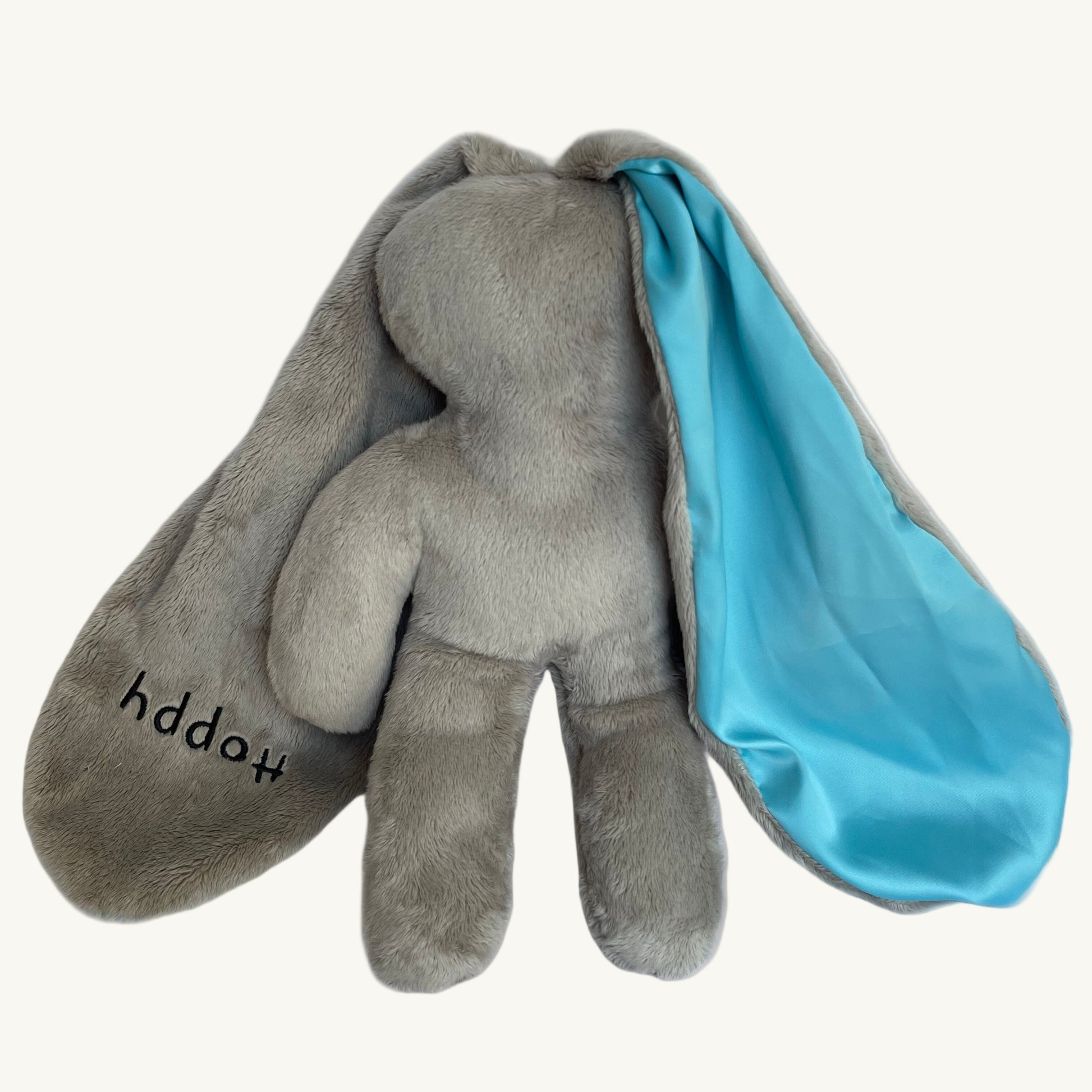 Sky Hoppy baby lovey bunny with soft gray plush and blue sensory-lined ears designed for soothing comfort.